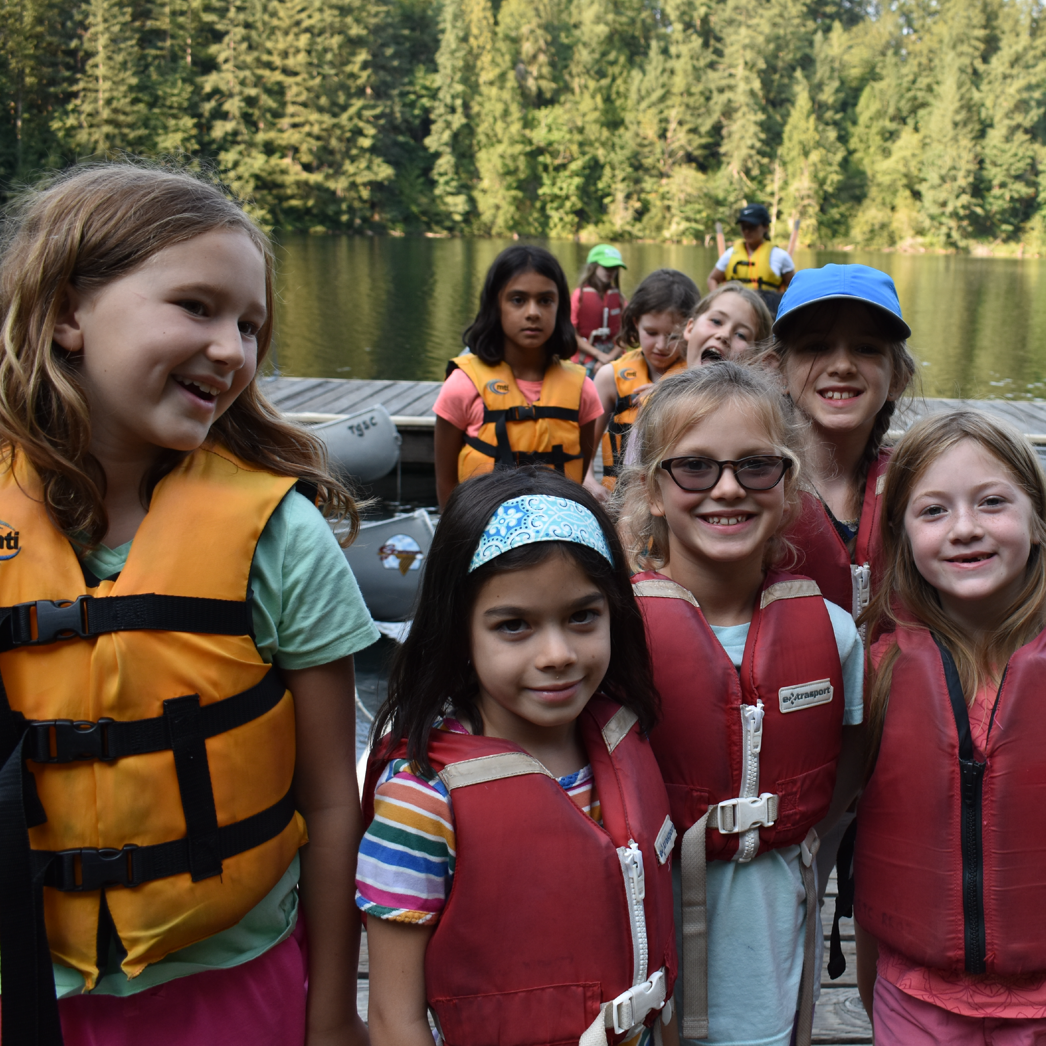 Girl Scouts in life vests on the water