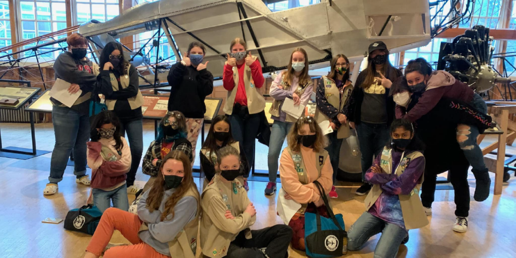 multiple Girl Scouts at aviation museum