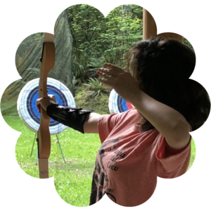 Girl Scout doing archery